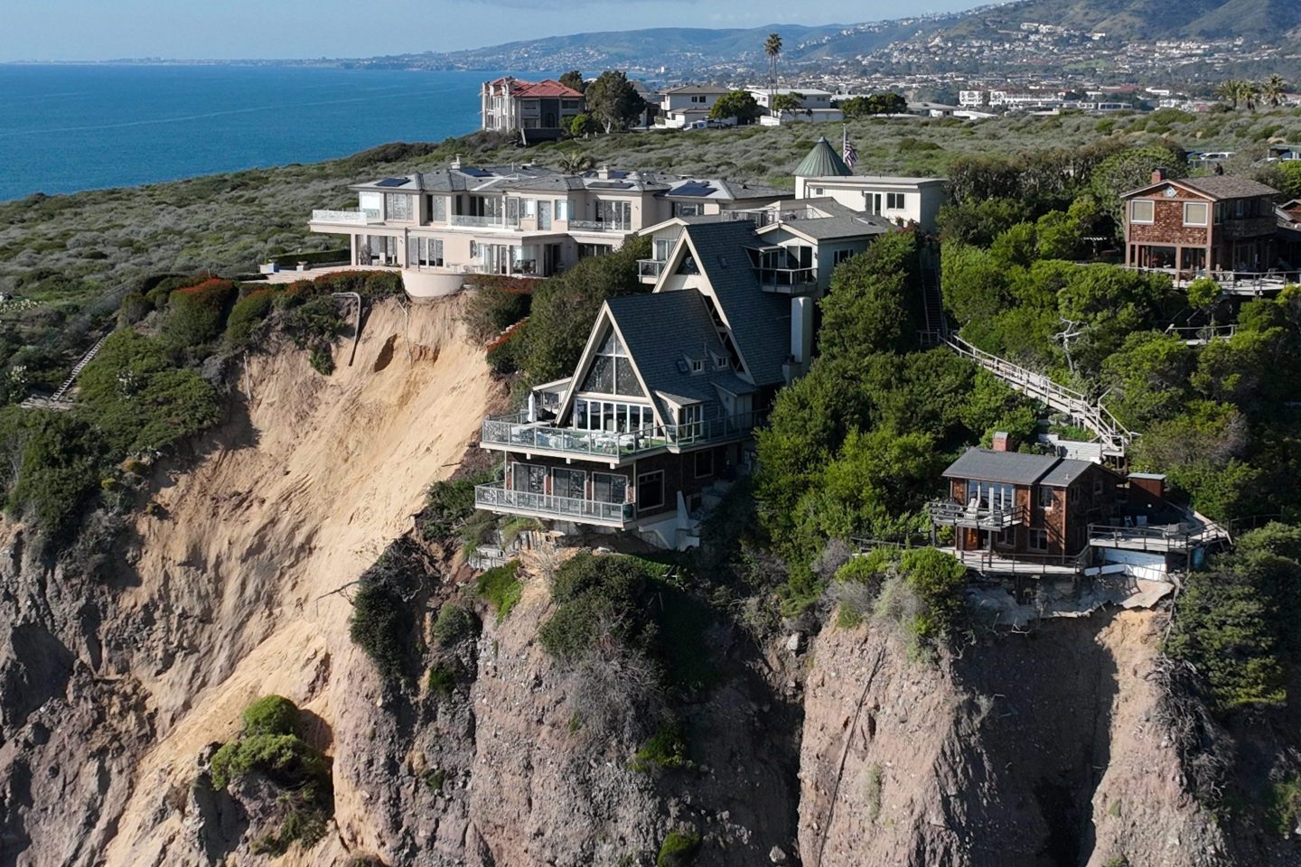 Houses overlooking a cliff in Dana Point, California, where houses recently fell victim to landslides