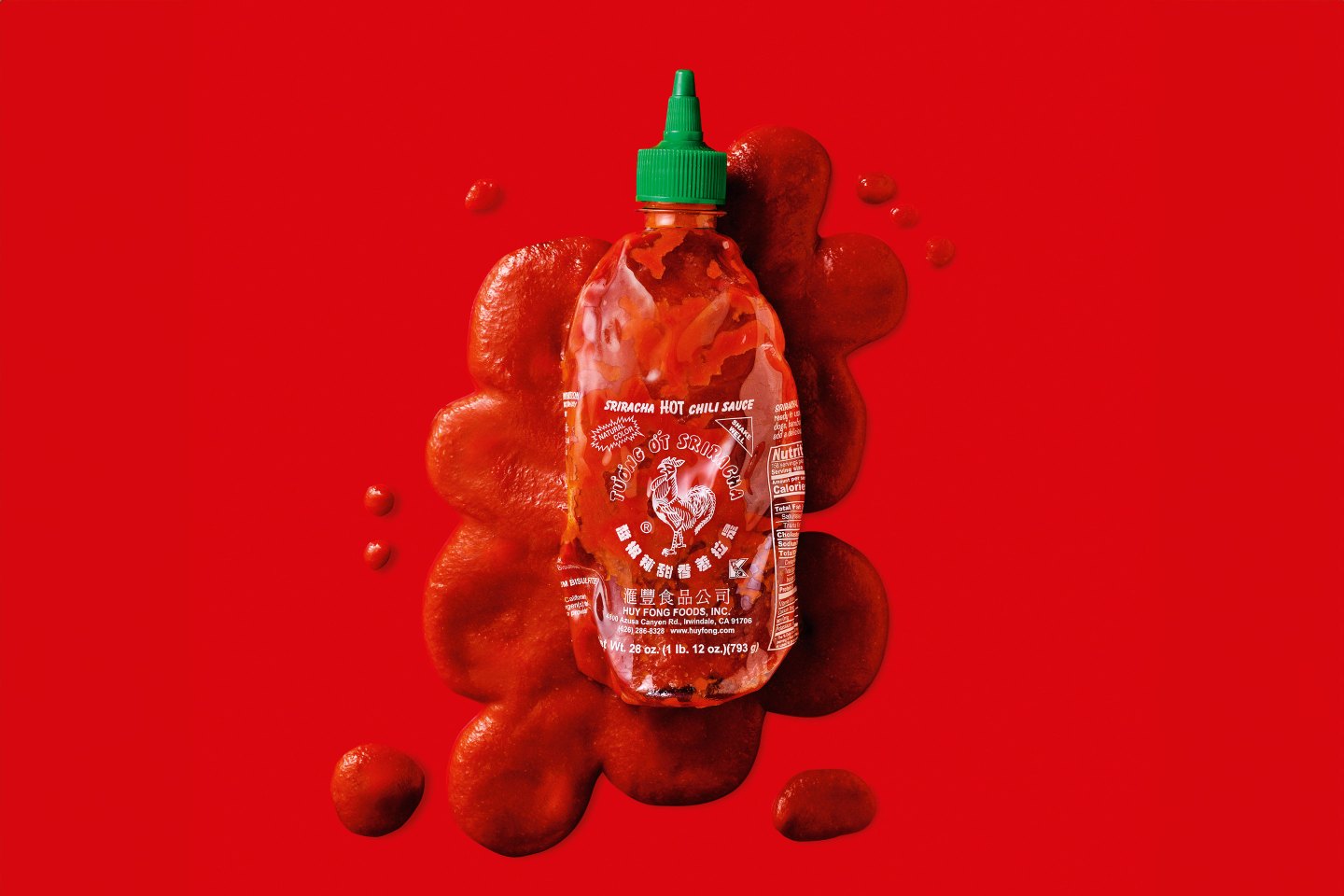 Huy Fong Foods Sriracha bottle melted with sauce seeping out.