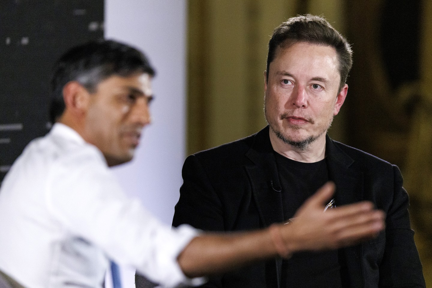 Elon Musk, chief executive officer of Tesla Inc., right, and Rishi Sunak, UK prime minister, during a fireside discussion on artificial intelligence risks in London, UK, on Thursday, Nov. 2, 2023. Sunak convened this week&#039;s AI summit in an effort to position the UK at the forefront of global efforts to stave off the risks presented by the rapidly-advancing technology, which in the prime minister&#039;s own words, could extend as far as human extinction. Photographer: Tolga Akmen/EPA/Bloomberg via Getty Images
